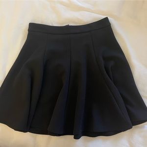 Black pleated mini skirt